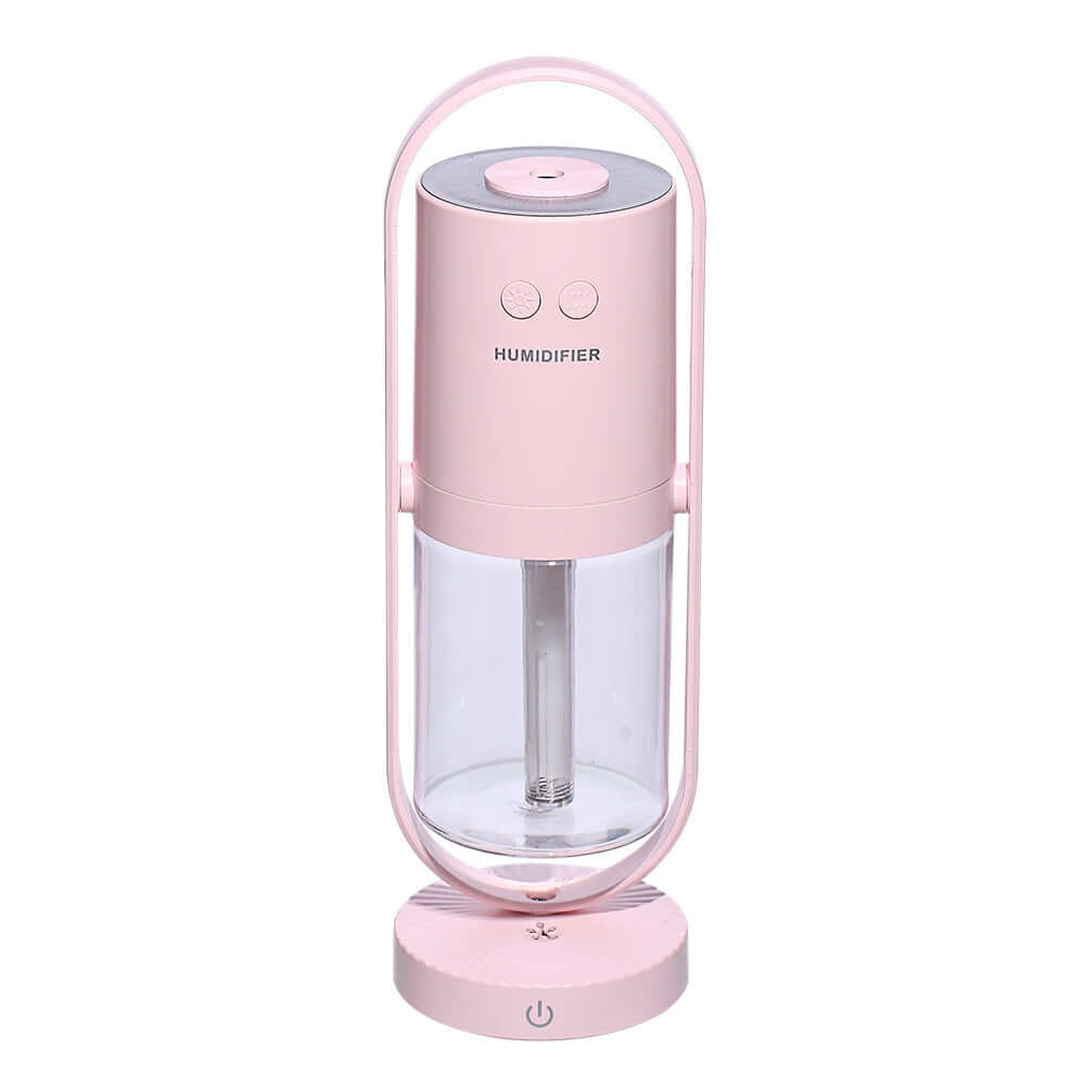 Pink anion humidifier with transparent water tank and controls, ideal for improving air quality.