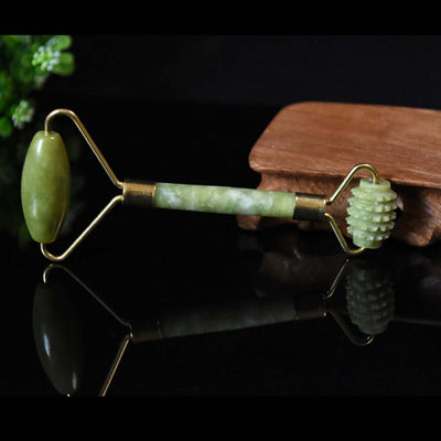 Natural jade beauty container massager roller for promoting skin elasticity and circulation, ideal for face and body use.